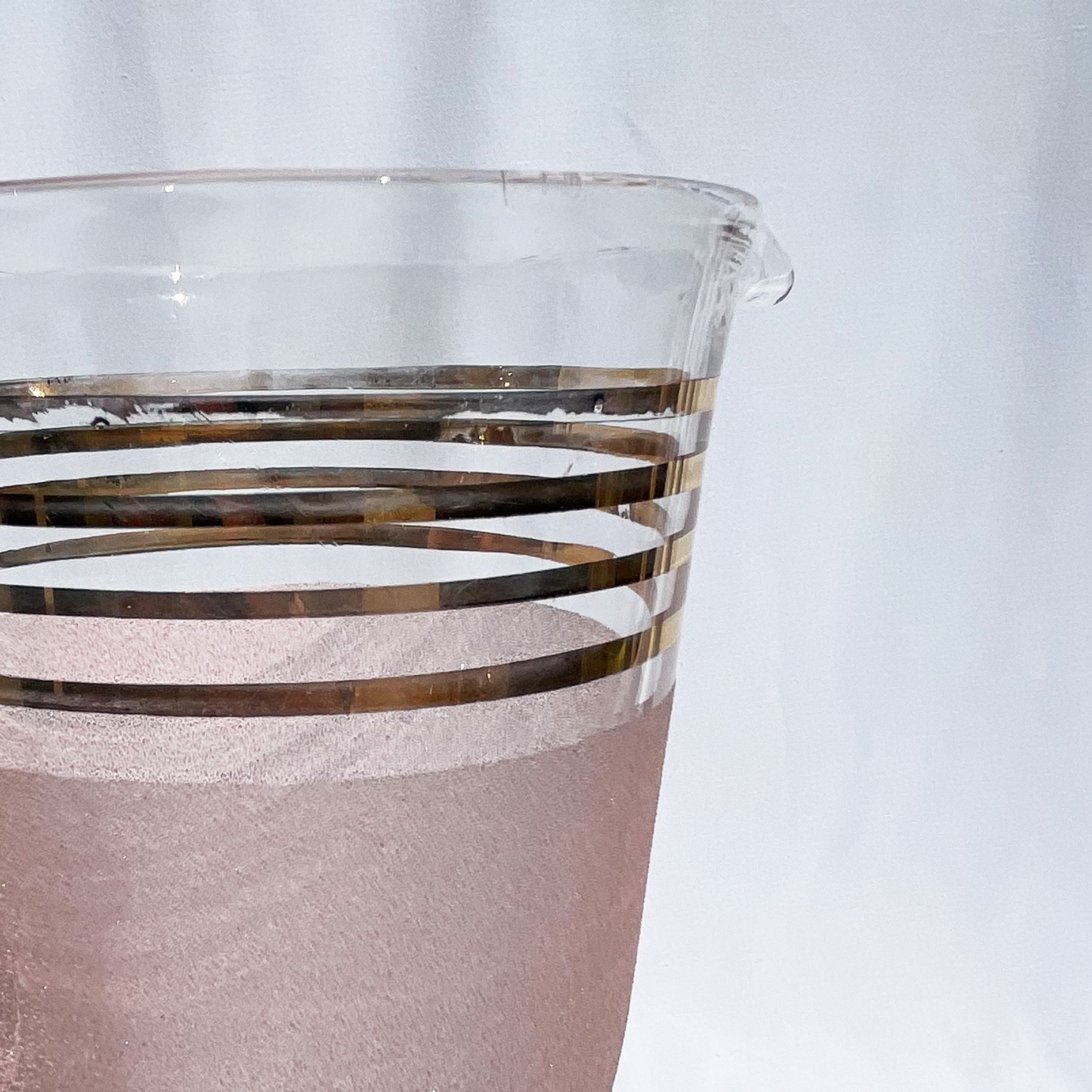 Pink and gold striped art deco style glass jug